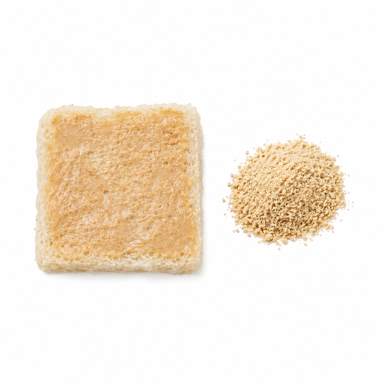 Nut butter spread thinly on soft bread, beside ground nut flour